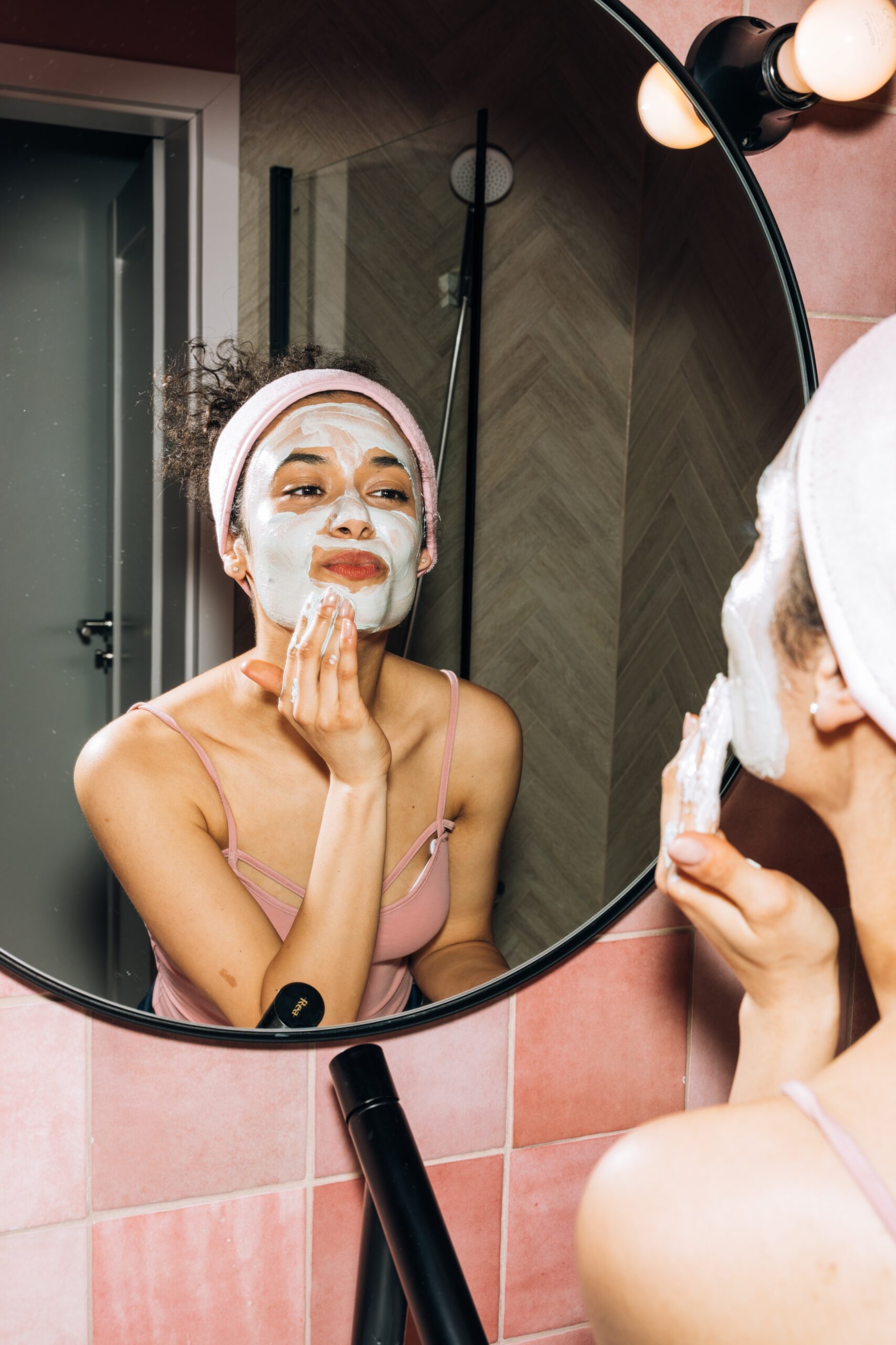 Young woman cleansing her face as part of a skincare routine