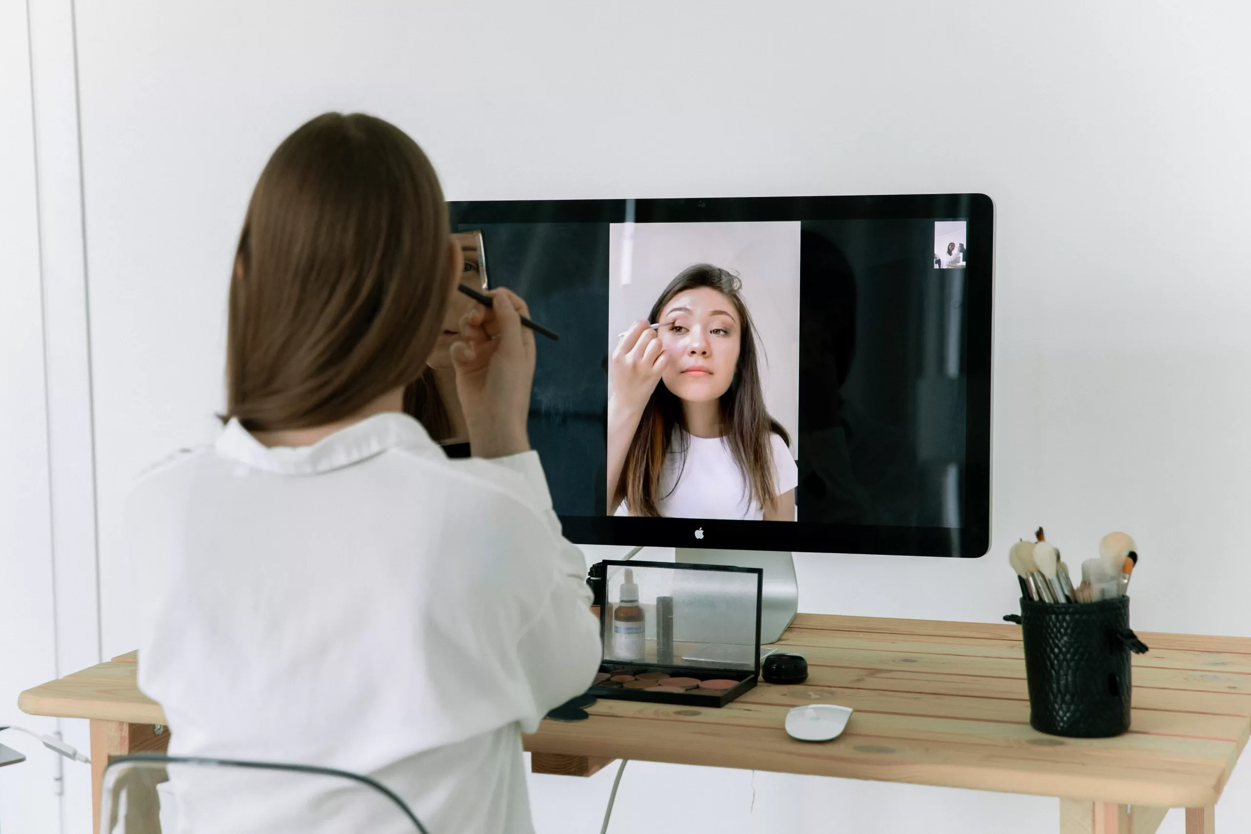 woman using technology to get makeup and beauty tips