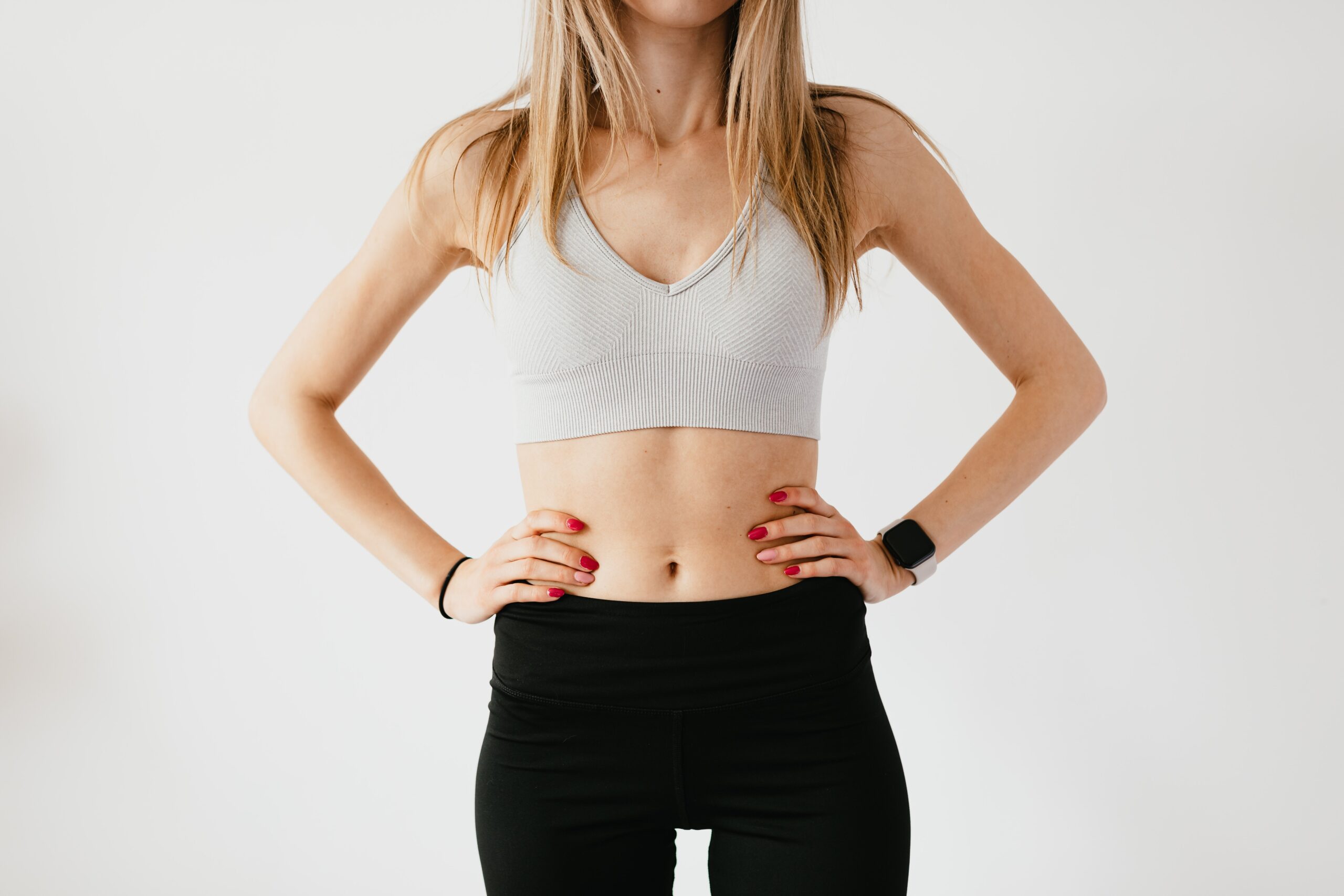 woman in athletic wear sports bra and leggings